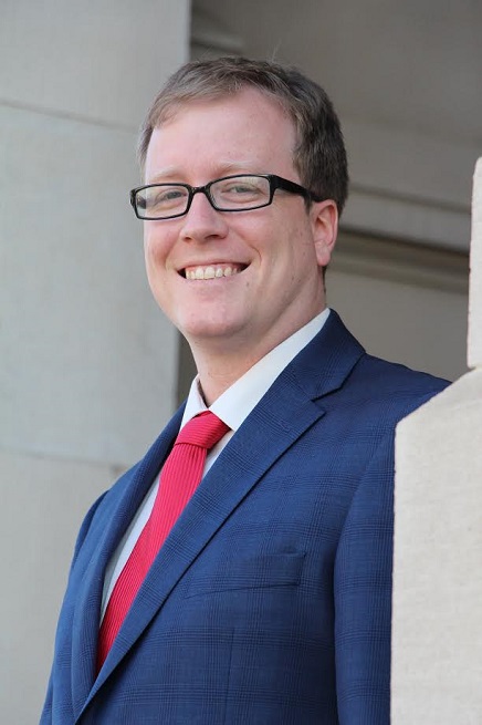 A picture containing person, necktie, person, suitDescription automatically generated